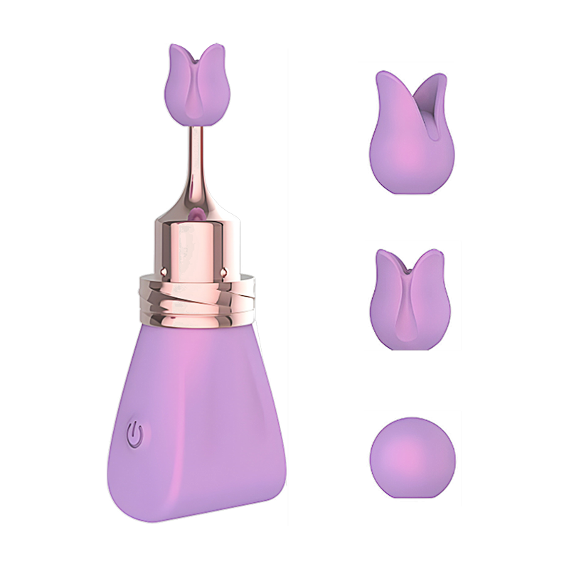 Purple bullet vibrator with three replaceable nozzles on the side on a white background